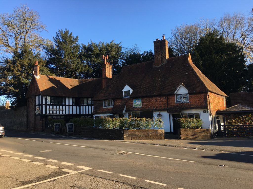 A roadside country pub on a bright, autumnal morning with a clear blue sky above